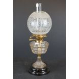 Late 19th / Early 20th century oil lamp with clear cut glass layered pattern font, brass base with