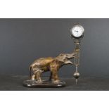 Early 20th century Cast Metal Elephant Mystery Clock, the trunk holding a Junghans Clock and three