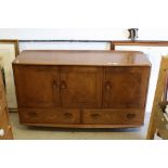Ercol ' Windsor ' Light Elm Sideboard with three cupboard doors over two drawers, with oval
