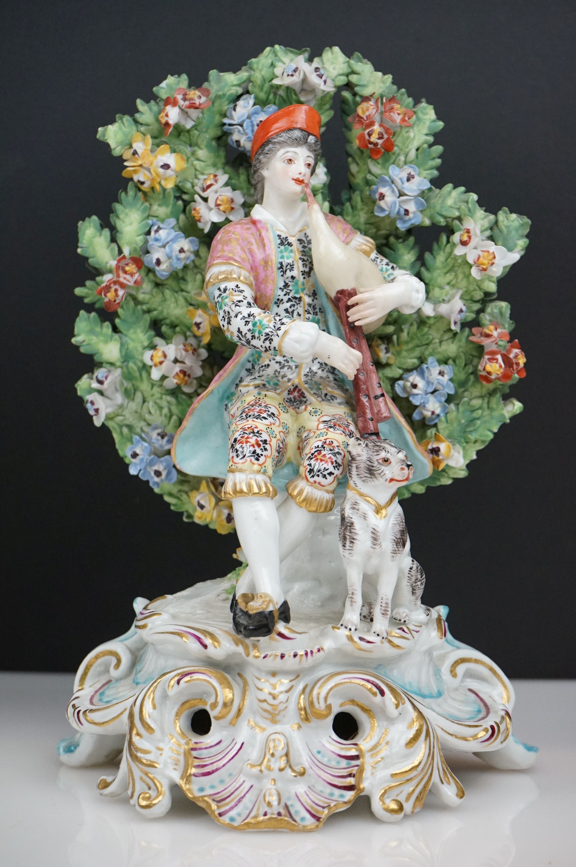 Pair of Chelsea Porcelain Bocage Figures in the form of a Man playing bagpipes with a dog and a - Image 5 of 6