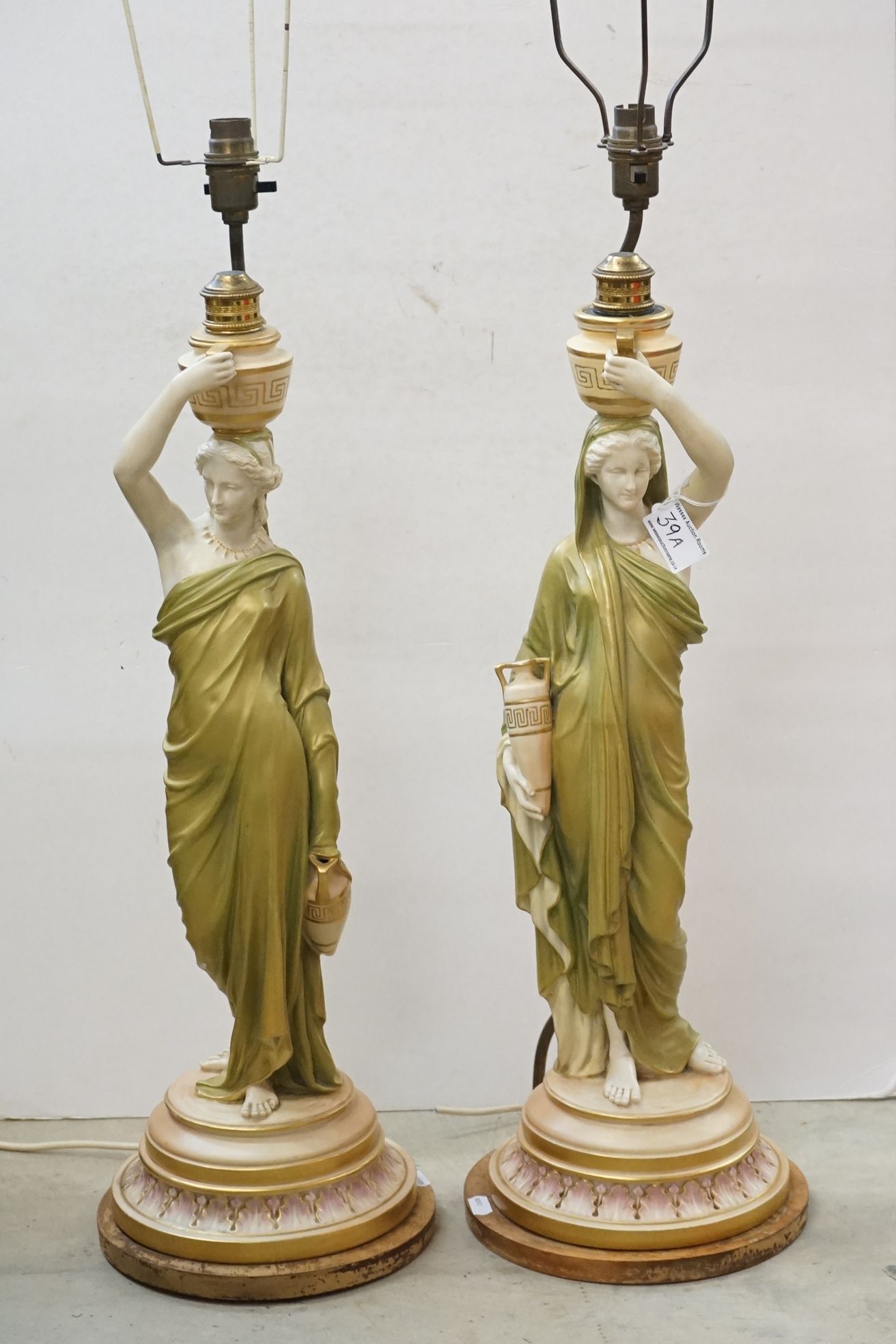 Pair of Royal Worcester ' Cricklite ' stem Figural Table Lamps in the form of Water Carriers