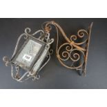 Wrought Iron Hanging Lantern with four dimple glass sides, 33cm high held on a scrolling iron