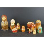 Two Early 20th century Wooden Stacking Dolls (sets not complete and with replacements) together with