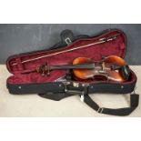 A violin and bow, unmarked, possibly German (Length of back 34cm) with Everest support together with