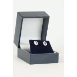 Pair of 18ct white gold Tanzanite and diamond cluster earrings