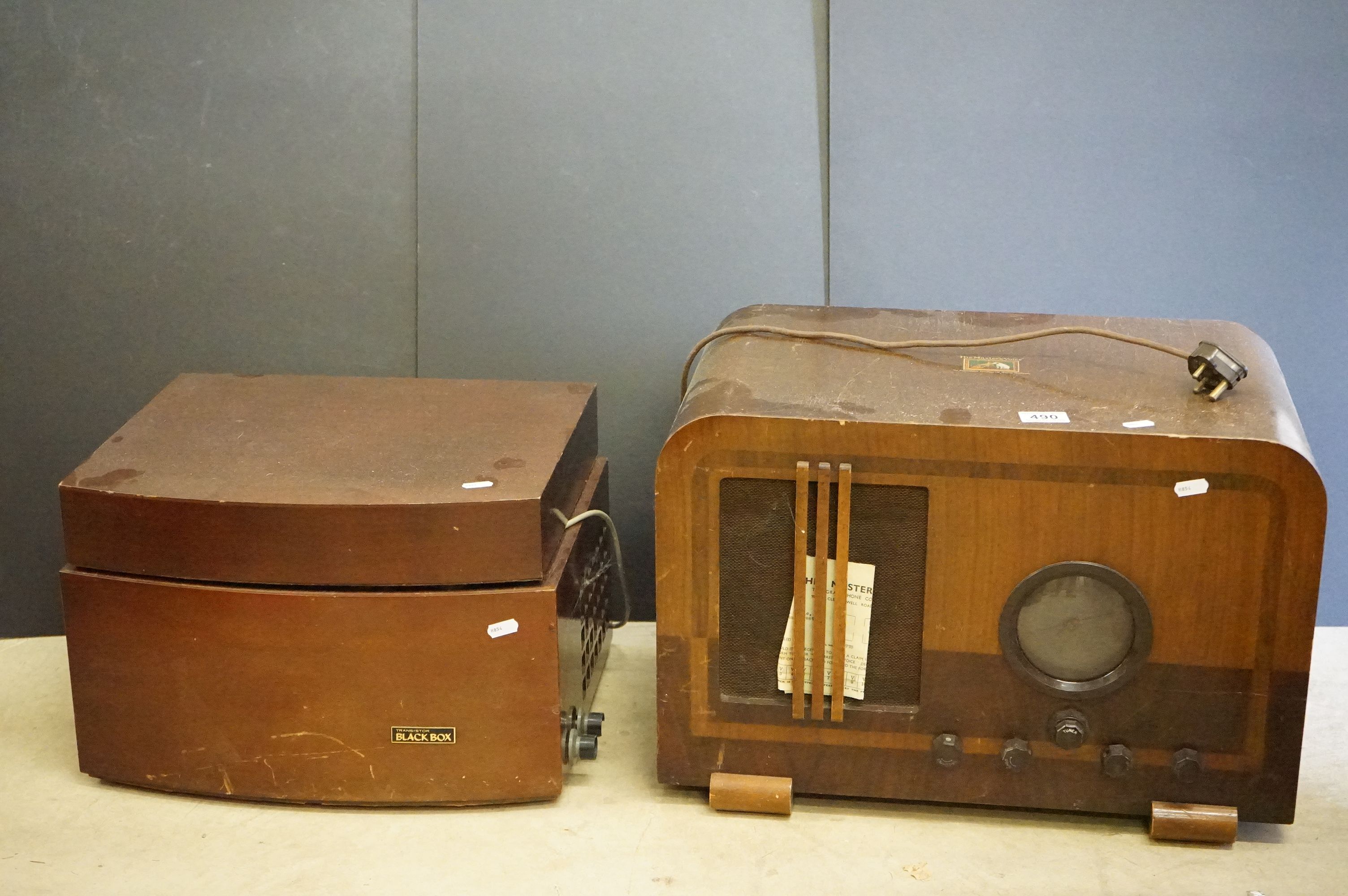 A vintage wooden cased HMV radio together with a wooden cased Monarch record player.