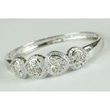 Silver bangle with four open hearts, set with CZ