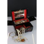 A jewellery box containing silver rings and fashion jewellery...etc.