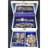 A jewellery box with contents to include gold, silver, brooches, costume jewellery and coins.