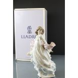 Lladro boxed 5898 ' Spring Splendor ' figure, depicting a young woman holding a basket of flowers,