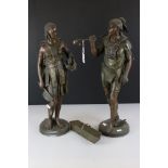 A pair of Bronzed metal tribal figures, stand approx 51cm in height.