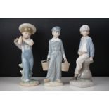Three Lladro porcelain figures to include a young girl carrying buckets, young girl holding a pond