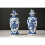 Near Pair of Chinese Porcelain Baluster Blue and Lidded Vases decorated with flowers in vases