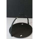 A fourteen inch cast iron fire hanging pancake pan by Kenrick