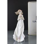 Lladro boxed 6777 ' Butterfly Treasures ' porcelain figure, depicting a young lady holding a trinket