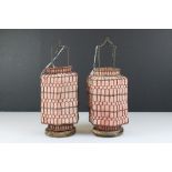 A pair of Chinese wire work lanterns with wooden bases and cloth shades.