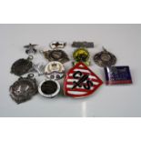 A collection of Enamel badges, pocket watch fobs and medals.