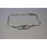 A silver and CZ designer style bracelet.