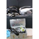 A collection of mixed motorcycle parts and accessories to include fairing / nose cone, exhaust,