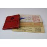 A mid 20th century driving licence together with petrol ration books.