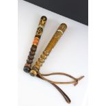 An antique police truncheon with painted kings cypher decoration together with a later example