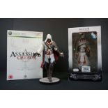 Two boxed Assassins Creed figures to include AC2 Xbox 360 White Edition Ezio Auditore (figure &
