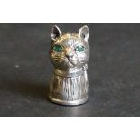 Silver pincushion in the form of a cat with emerald eyes