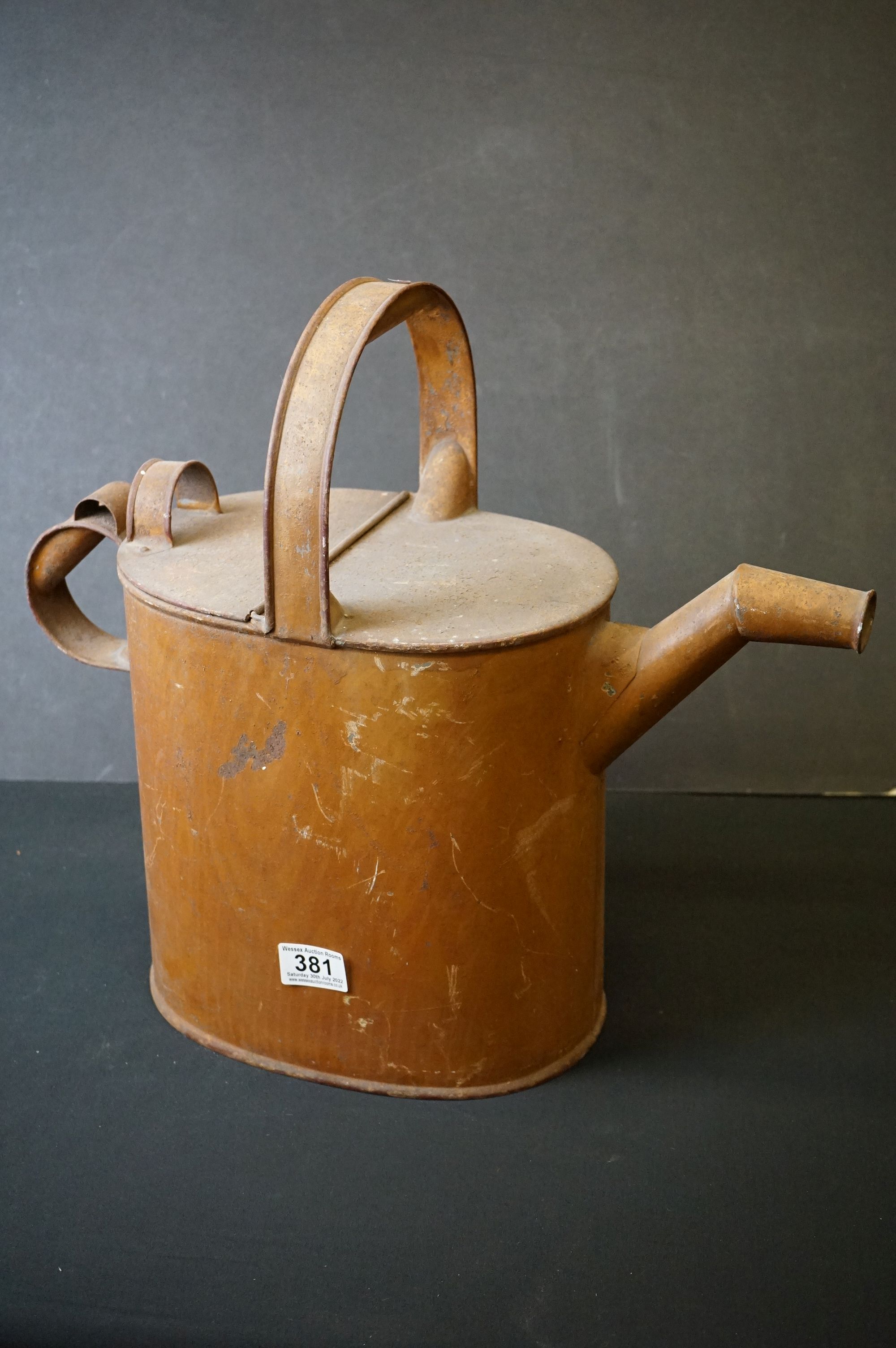 Antique metal aesthetic watering can