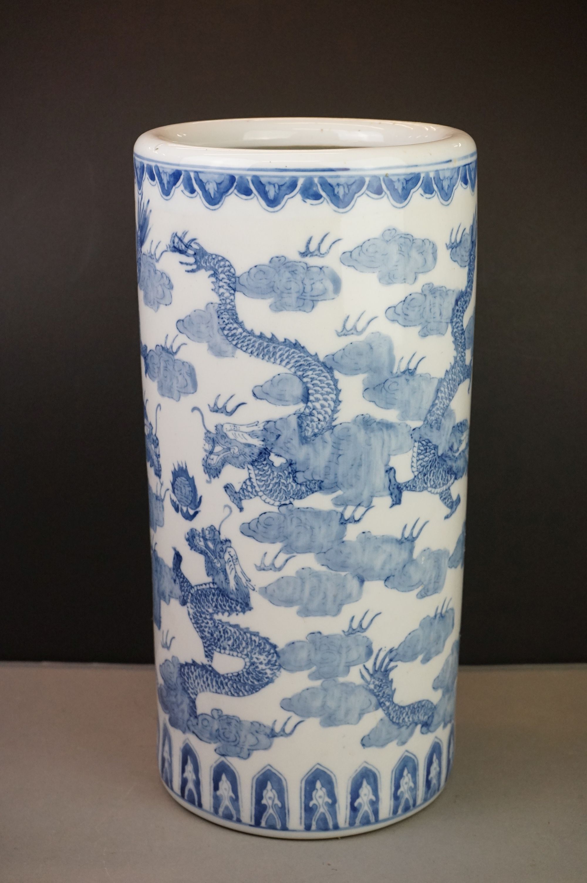 Chinese Blue and White Ceramic Stick Stand decorated with dragons, 46cm high