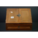 A contemporary wooden stationary box with velvet lined drawer.