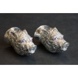 Pair of condiments in the form of boars heads with ruby eyes, stamped 800