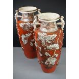 Pair of ceramic Japanese twin-handled vases with prunus decoration, signed to base