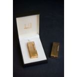 Two gold plated Dunhill lighters to include a cased example.