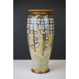 Royal Doulton stoneware vase with floral trailing decoration on pale green ground, impressed 7919 to