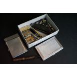 A small box of collectables to include cigarette cases, lighters, penknives and whistles.