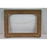 Large 19th century fine ornate gilt picture frame having domed cornered inner slip, approx. 64.5cm x
