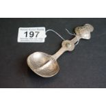 White metal arts and crafts spoon with engraved decoration