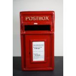 A reproduction red letter box with cast iron front and steel case.