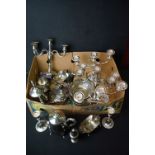 A collection of mixed silver plate to include candlesticks, tea set, fruits bowls....etc..