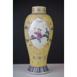 Chinese Famille Rose Vase decorated with panels of figures on a yellow ground, red character marks