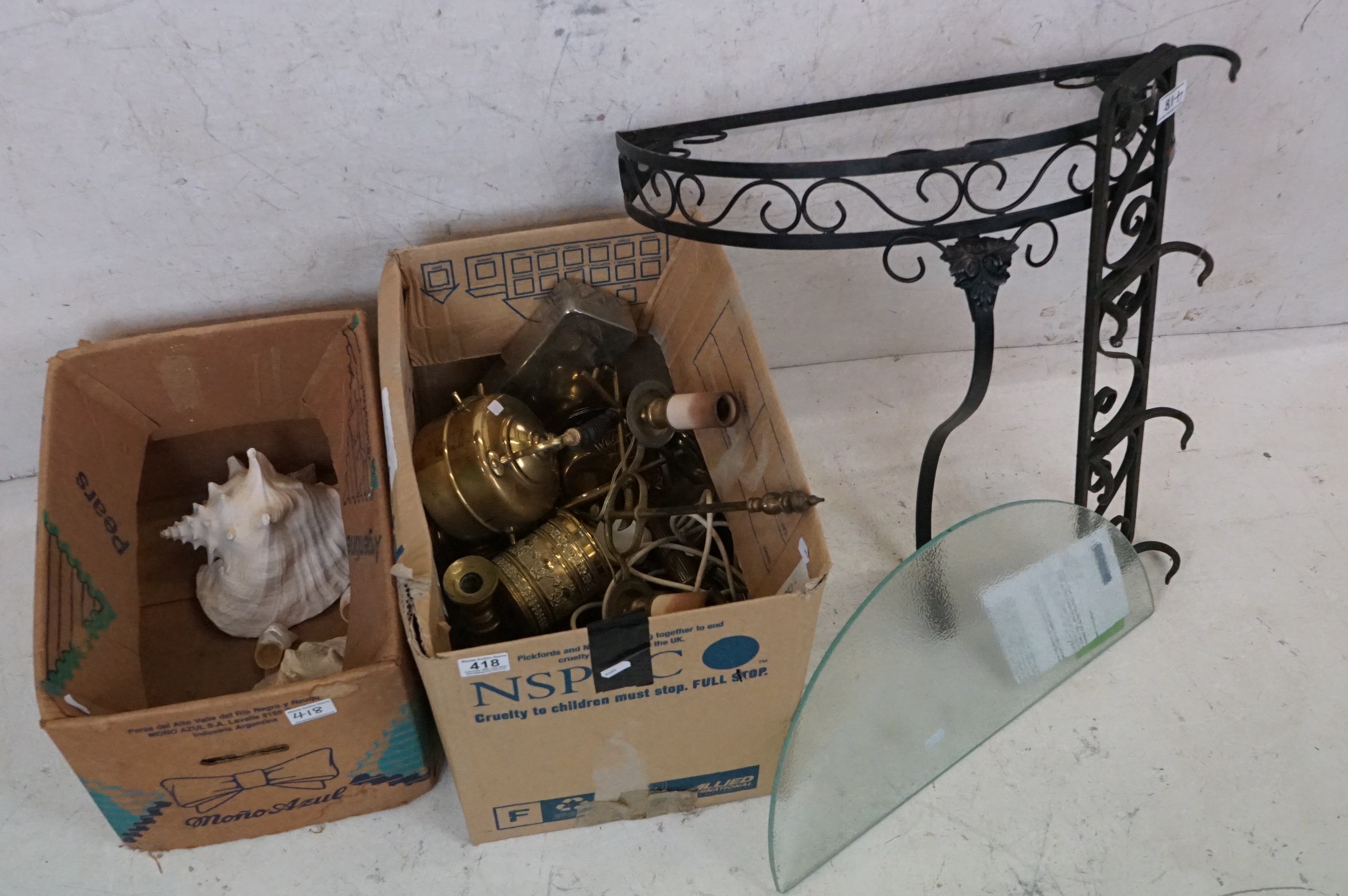 A group of mixed collectables to include Brassware, sea shells and a wrought iron coat hanger.