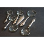 Set of six graduated silver plated magnifying glasses