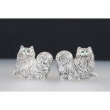 Pair of silver plated condiments in the form of cats with emerald eyes