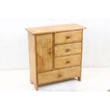 A late Victorian pine unit of three short drawers and one long drawer with cupboard to the side.