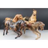 Four leather horse models, with saddles and harnesses, tallest 32cm