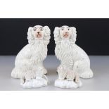 Two antique Staffordshire spaniels, together with pair of similar 19th century sheep