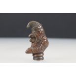 A bronzed vesta case in the form of Mr. Punch.