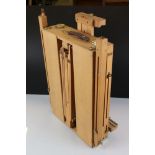 A wooden folding box artists easel table.