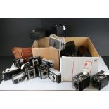 A large collection of cameras to include Kodak, Ilford and Petri examples.