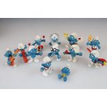 A small collection of approx twelve Smurf figures.